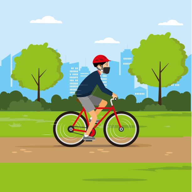 在公园骑自行车时戴口罩的男子图片下载