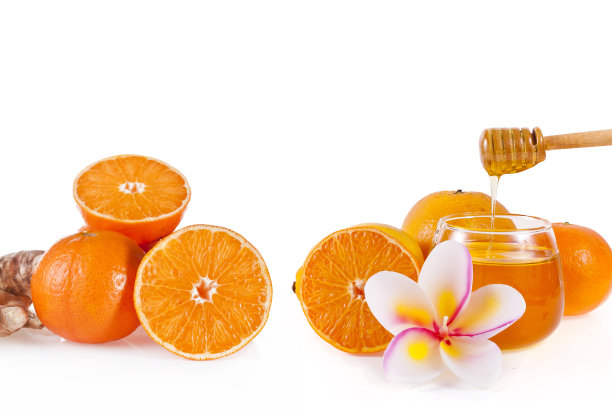 蜂蜜和蜡烛的形状的花和橙色水果图片下载