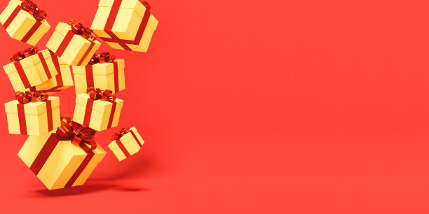 金色的礼品盒上飘着红丝带图片下载