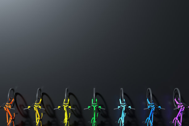 彩虹色的山地自行车在一排孤立的黑色背景图片下载