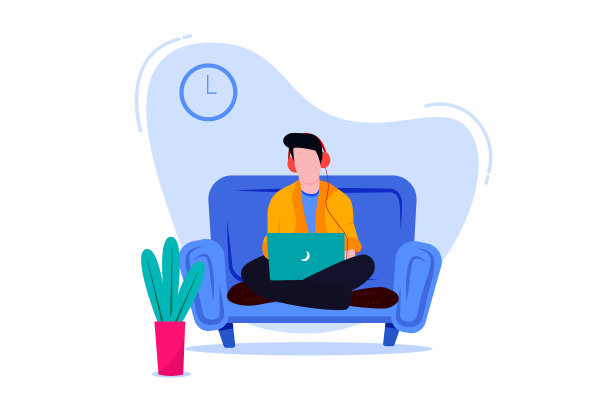 一名男子使用笔记本电脑和耳机在家工作图片下载