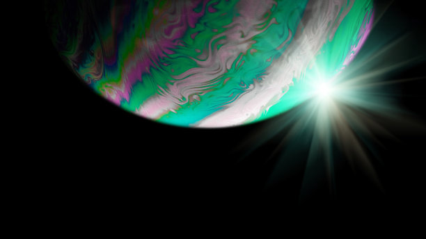 泡沫的颜色。银河系宇宙空间中的地球，黑色背景上的抽象太阳。彩色抽象荧光油墨在水中。图片下载