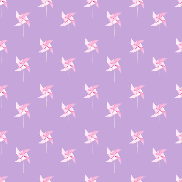 淡紫色背景上的粉色纸风车图片下载