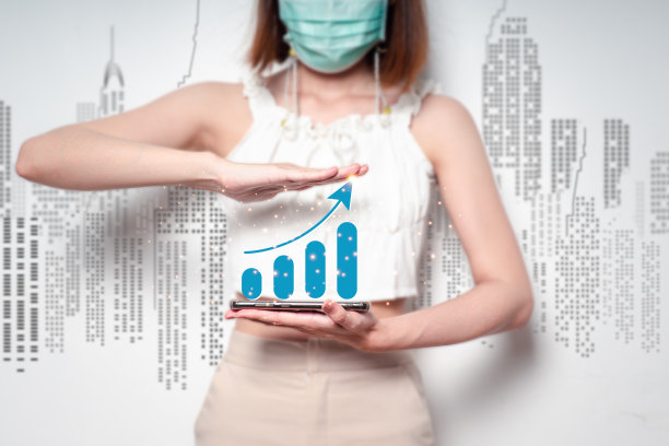 屏幕上有一个股票走势图，背景模糊。图片下载