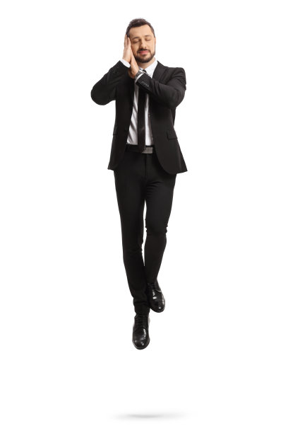 西装革履的商人在空中睡觉图片下载