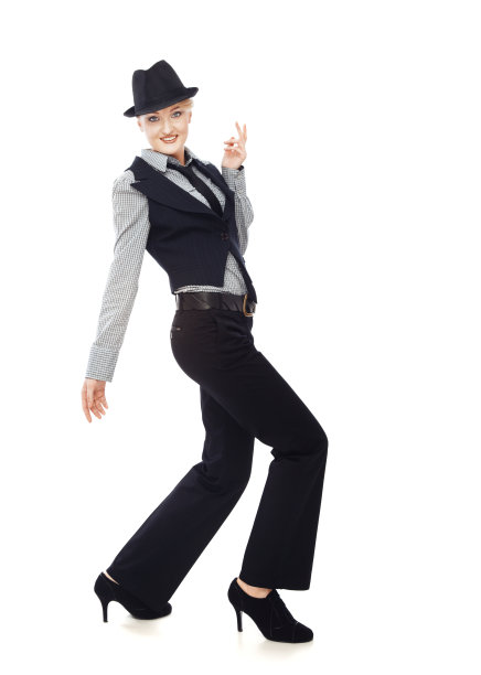 微笑的女人在时尚的商务服装走在白色的背景图片下载