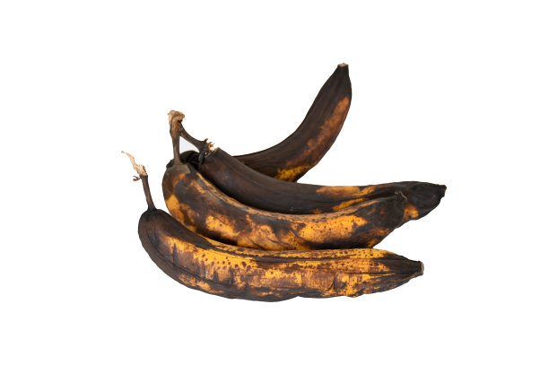 腐烂的香蕉，黑皮，深棕色和黄色，不新鲜。不健康和过期的水果。图片下载