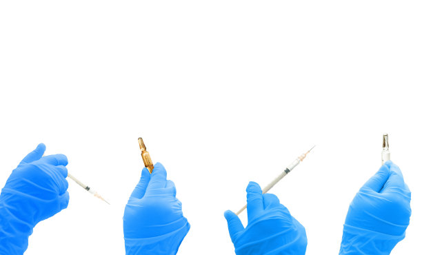 蓝色手套手持注射器和小瓶隔离在白色空白区域图片下载