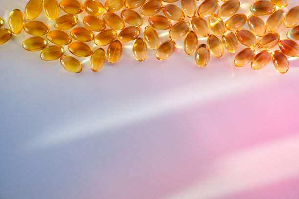 粉红色和蓝色背景的美容胶囊图片下载