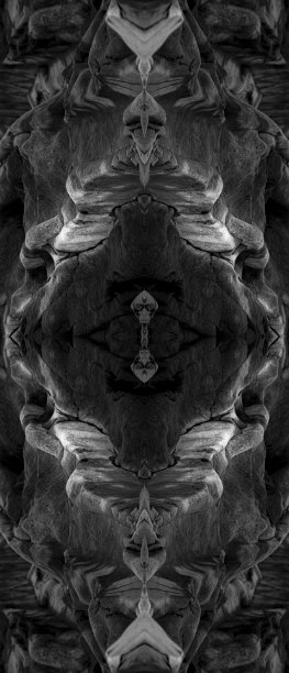 迷幻脸，由海石，对称万花筒镜，抽象背景。图片下载