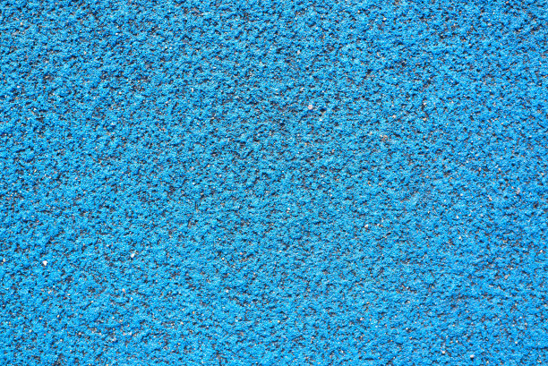 蓝色背景纹理。运动场、跑道、网球场的橡胶防护罩。俯视图，特写，外面图片下载