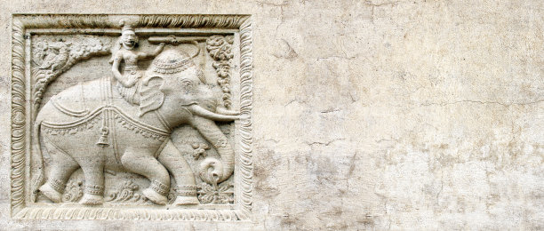 Grunge背景与石头纹理和浅浮雕与大象骑士图片下载