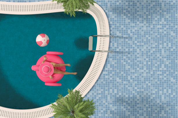 年轻女子在游泳池日光浴与充气火烈鸟，暑假概念图片下载