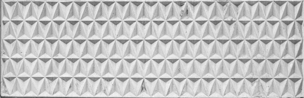 宽装饰混凝土墙板纹理与几何图案的浮雕三角形的形式。图片下载