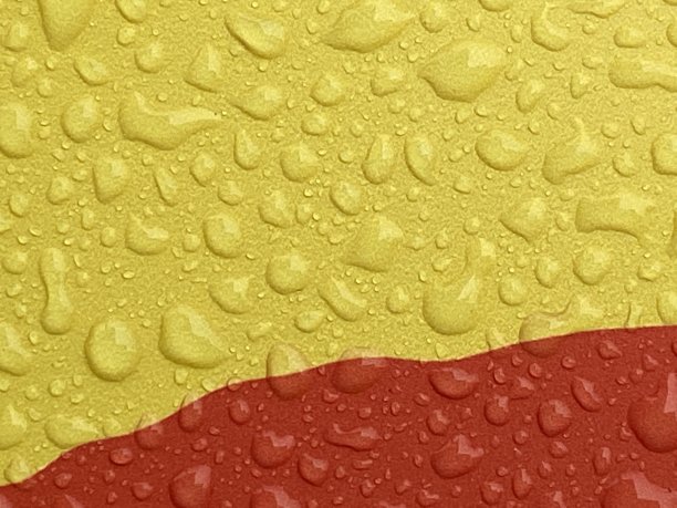 水滴在黄色和红色上图片下载