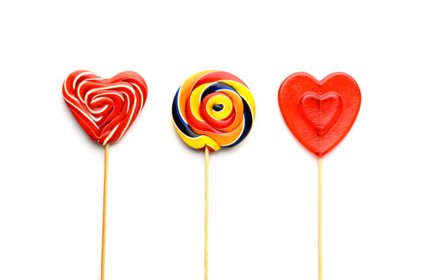 三个棒棒糖在白色孤立的背景图片下载
