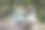 女孩戴着口罩看手机，穿着衣服，戴着帽子坐在公园里，旁边放着一辆自行车图片下载