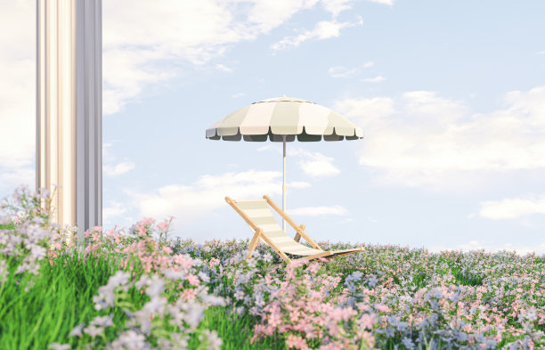 春花田野景色与沙滩椅和伞。图片下载