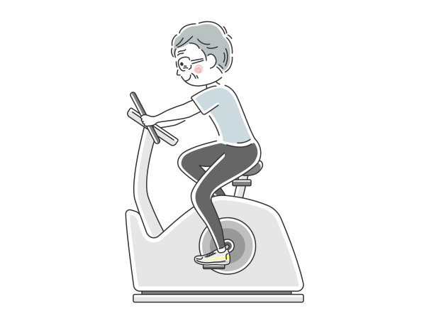 骑健身自行车的人。图片下载