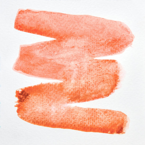 一个抽象的橙色水彩在纸上的照片图像，手画橙色水彩为背景，湿技术在纸上图片下载