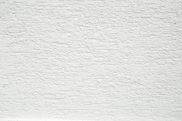 白色立面墙纹理粗糙的灰泥近。图片下载