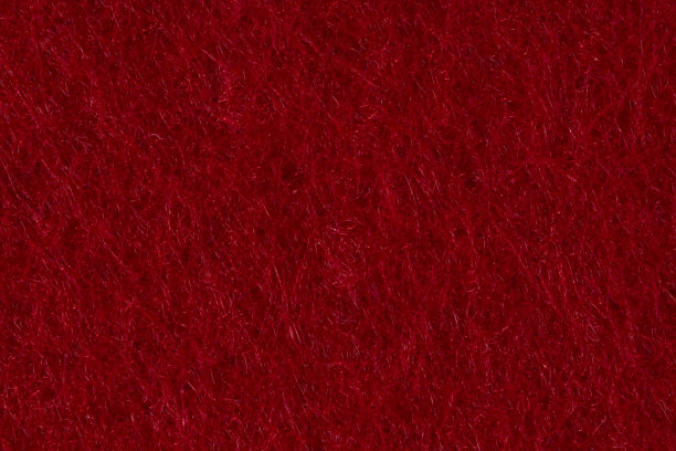 质地鲜红的毛毡作为背景或背景。图片下载