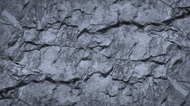 灰色岩石纹理，有裂缝。石墙背景与文本和设计的复制空间。宽横幅。图片下载
