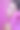 美丽的时尚女孩长卷发摆造型与一个粉红色的蝴蝶结。画室里以粉红色为背景的女孩。时尚、美丽。明亮的化妆。头发化妆品，健康头发。图片下载
