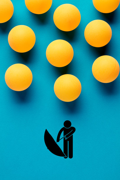 设计成雨滴形状的乒乓球落在一名男子试图打开伞的图案上。图片下载