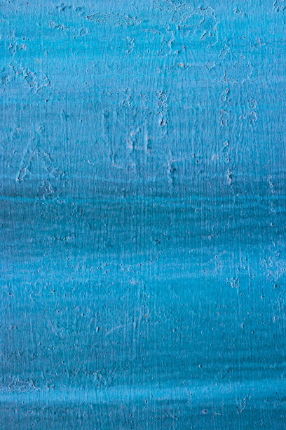 垂直照片的抽象波浪背景纹理画在蓝色和剥落随着时间的油漆。颜色很差的金属，有刷屑和碎裂的痕迹。高质量的照片图片下载