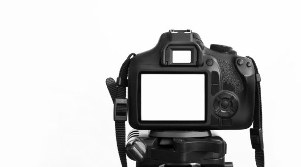 三脚架上的现代单反相机，白色背景上的孤立图片下载