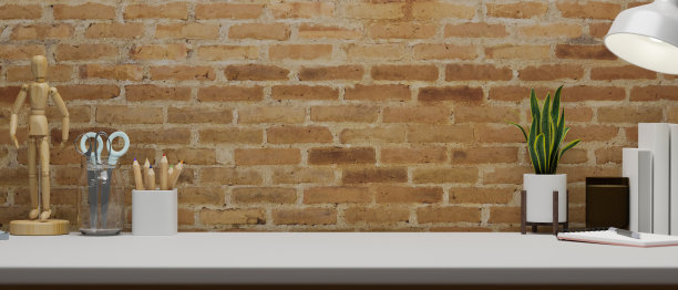 当代办公空间与文具、用品、装饰和复制空间的桌子与砖墙，3D渲染图片下载