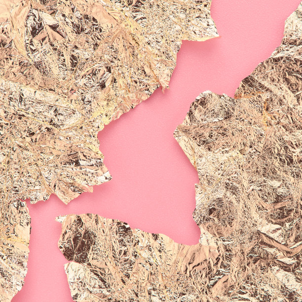 金色的纸或金箔上的粉色抽象背景，魅力的背景。图片下载