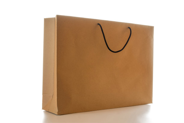 棕色纸袋质地。卡夫回收包装与空白空白的设计模型隔离在白色背景。送货服务的概念。副本的空间。广告区域。图片下载