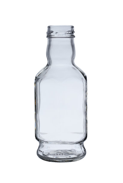 用来装调味汁和果汁的空的、打开的透明玻璃瓶。被孤立在白色背景下，特写镜头图片下载