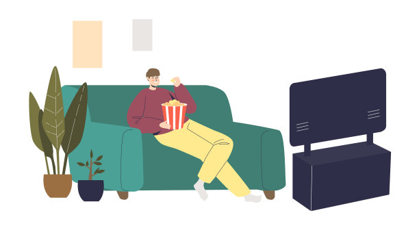 一个男人坐在沙发上看喜剧电影图片下载