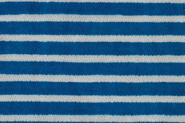 特写面料纹理与蓝色条纹作为背景。图片下载