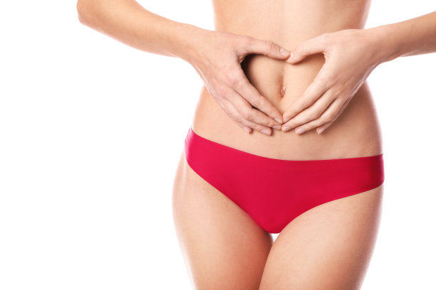 美丽的女人穿着红色内衣孤立在白色的背景下，概念月经图片下载