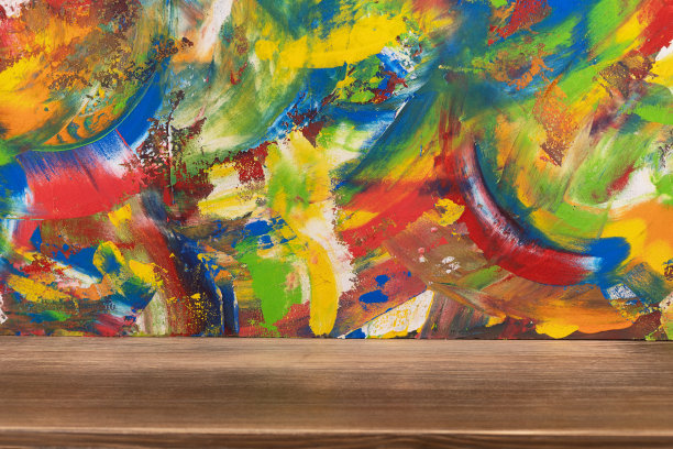 木桌上色彩斑斓的背景纹理。抽象油画背景图片下载