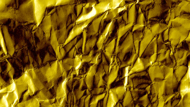 金色皱巴巴的纸背景。金纸纹理图片下载