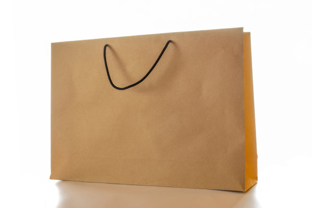 棕色纸袋质地。卡夫回收包装与空白空白的设计模型隔离在白色背景。送货服务的概念。副本的空间。广告区域。图片下载