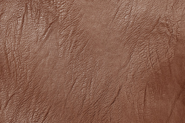 深棕色皮革纹理背景与无缝图案。图片下载