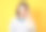 严肃的年轻女子看着相机，黄色背景上的孤立。一个美丽的女孩的正面视图肖像图片下载