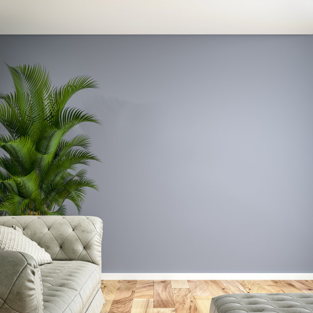 灰色沙发、脚凳、郁郁葱葱的树叶装饰和复制空间的空雅室内图片下载