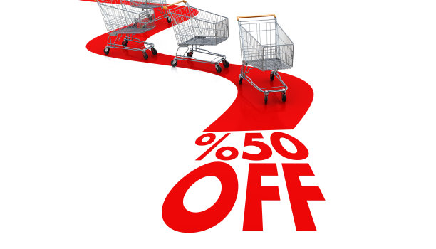 购物销售- 50%的折扣与购物车隔离在白色图片下载
