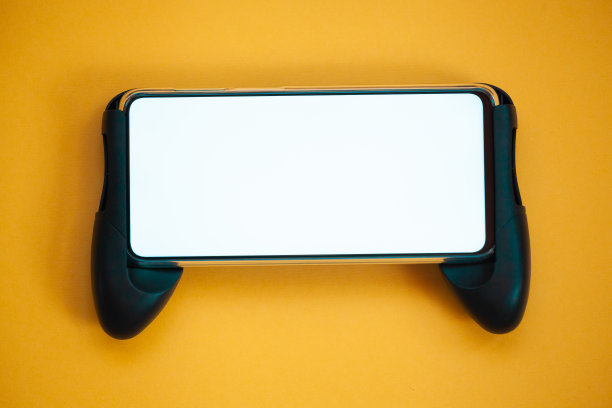 操纵杆手机，屏幕模型孤立的黄色背景俯视图图片下载