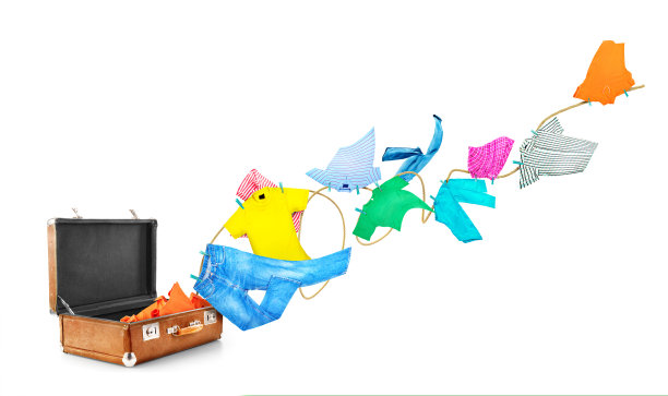 衣服从箱子里飞到晾衣绳上，在白色的背景上被隔离开来。图片下载