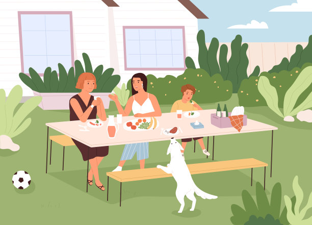 一家人坐在后院的餐桌前图片下载