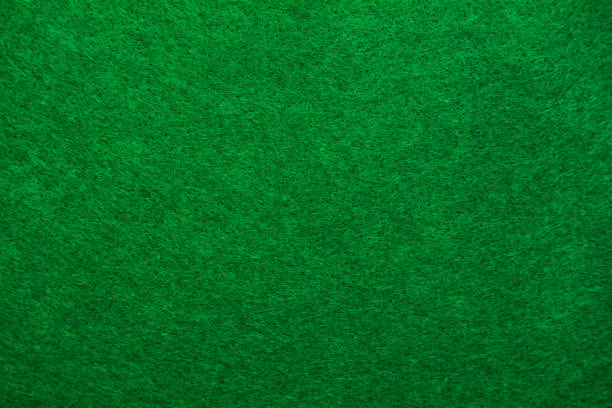 一个绿色毛毡材料背景的特写。图片下载