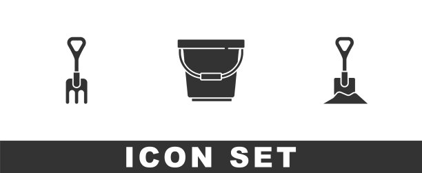 在地面上放置花园耙斗和铲子图片下载